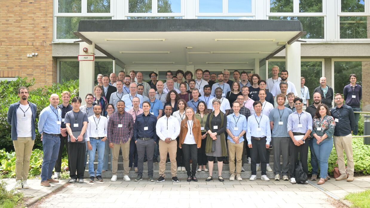 Participants joining a group photo at the workshop in Garching in front of the IPP building